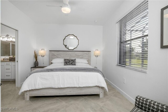 bedroom featuring ceiling fan, connected bathroom, and light tile patterned floors