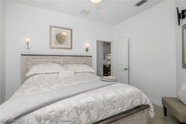 bedroom with ceiling fan, visible vents, and baseboards