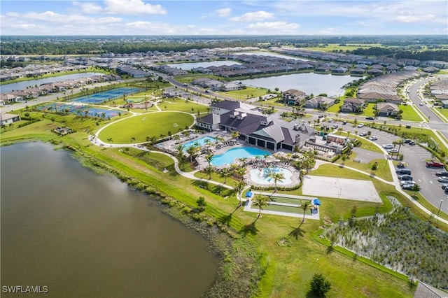 birds eye view of property featuring a water view and a residential view