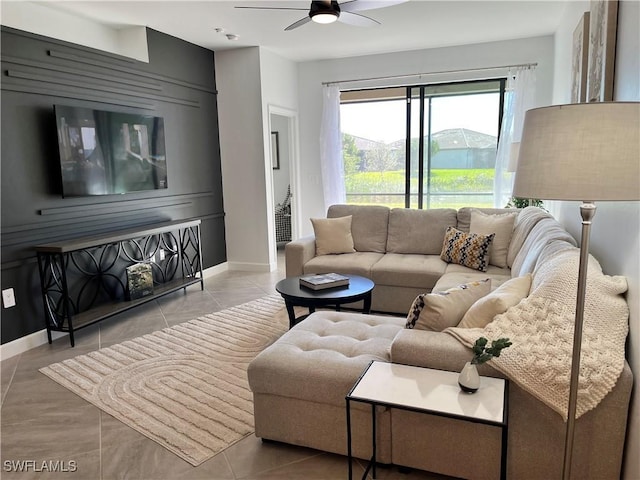 tiled living room featuring ceiling fan