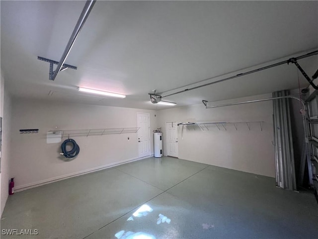 garage featuring a garage door opener and water heater