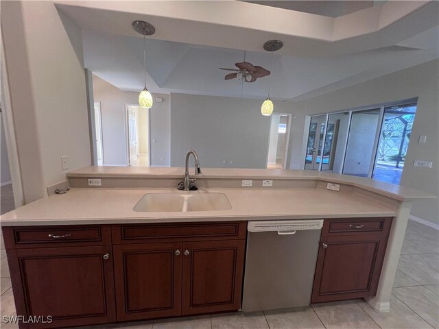 kitchen featuring ceiling fan, dishwasher, sink, hanging light fixtures, and light tile patterned floors