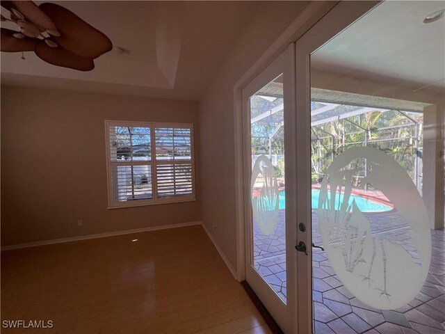 doorway featuring hardwood / wood-style flooring, plenty of natural light, and french doors