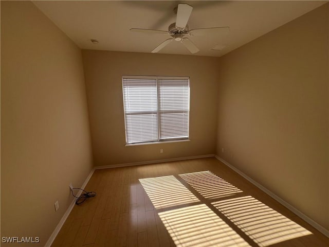 unfurnished room with ceiling fan and light wood-type flooring