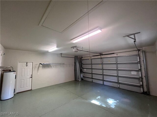 garage featuring a garage door opener and water heater