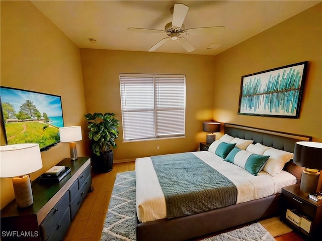 bedroom featuring ceiling fan and light hardwood / wood-style floors