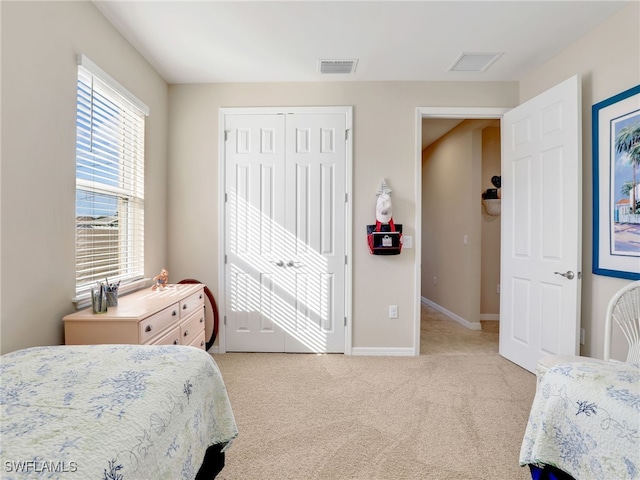 carpeted bedroom with a closet