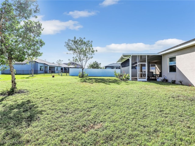 view of yard featuring a sunroom