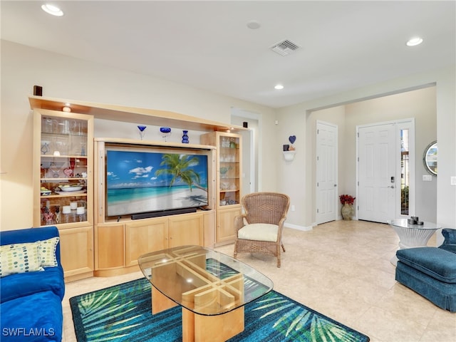 living room with light tile patterned flooring