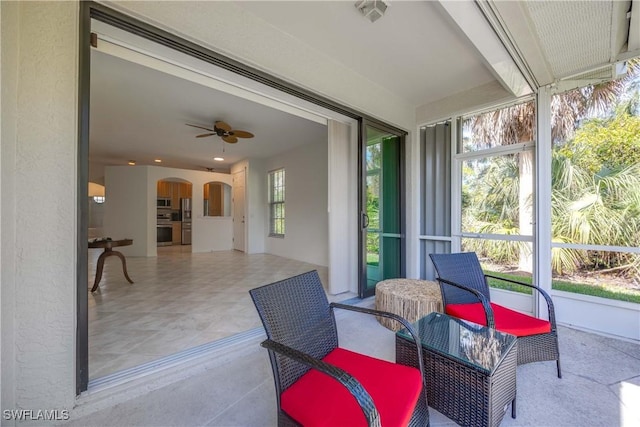 sunroom / solarium with ceiling fan