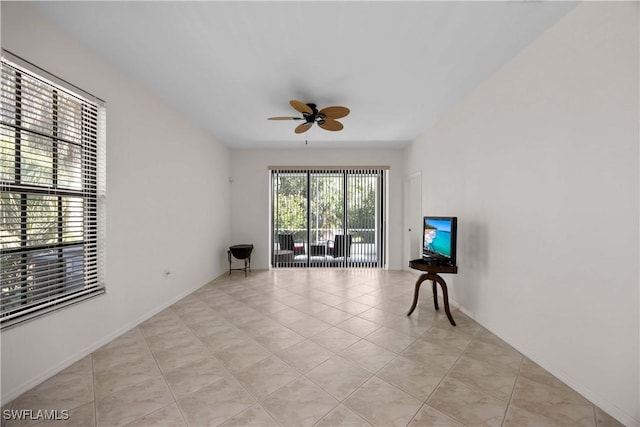 sitting room featuring ceiling fan and light tile patterned floors