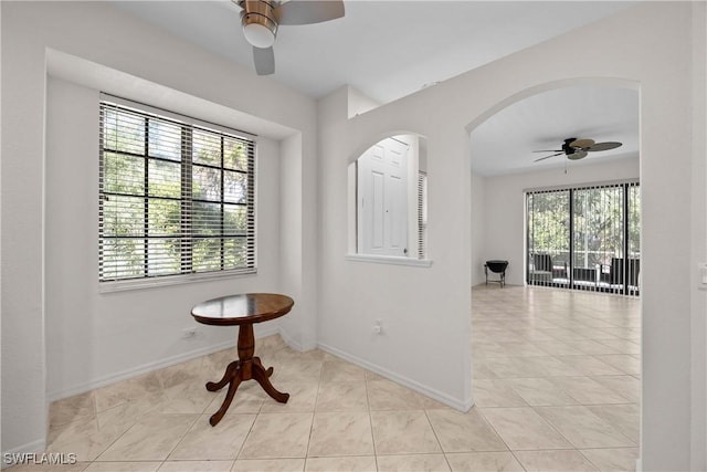 interior space featuring ceiling fan and light tile patterned flooring