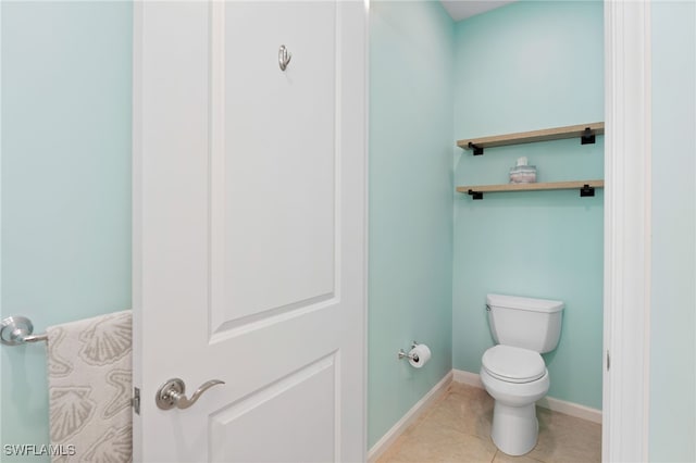 bathroom featuring tile patterned flooring and toilet