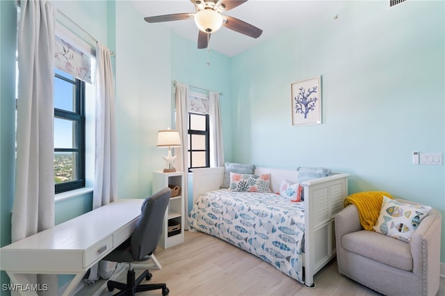 bedroom featuring ceiling fan and light hardwood / wood-style flooring