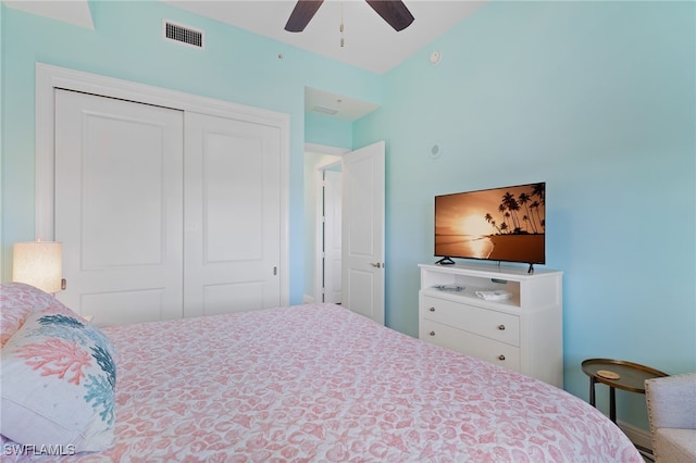 bedroom with ceiling fan and a closet