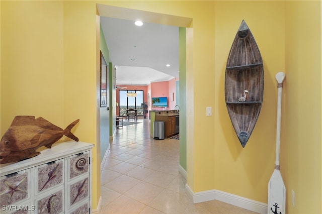 hallway with light tile patterned floors