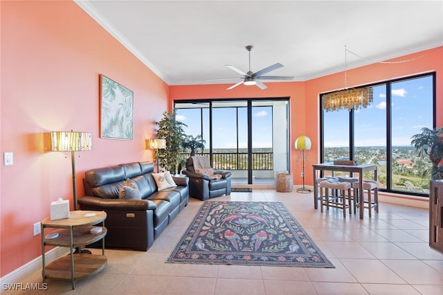 tiled living room with ceiling fan and crown molding