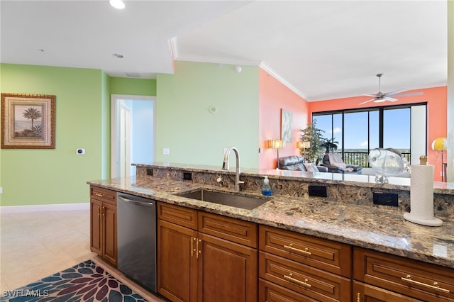 kitchen with light stone countertops, stainless steel dishwasher, ornamental molding, ceiling fan, and sink