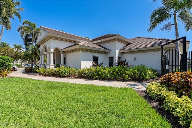 view of front of home with a front lawn