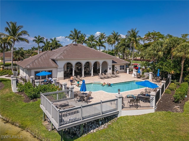 view of pool featuring a yard and a patio