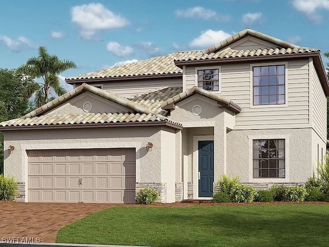 view of front facade with a garage and a front yard