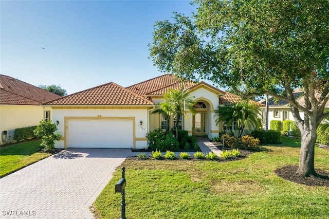 11063 Sea Tropic Ln, Fort Myers, FL 33908 - mediterranean / spanish-style house with a front lawn and a garage