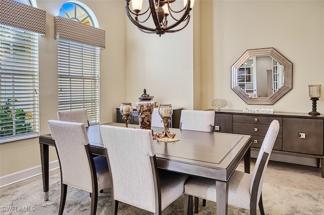 dining room featuring an inviting chandelier and a wealth of natural light