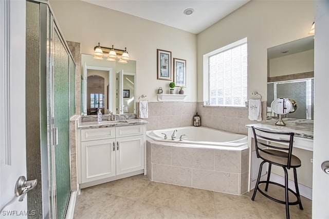 bathroom featuring tile patterned flooring, vanity, and independent shower and bath