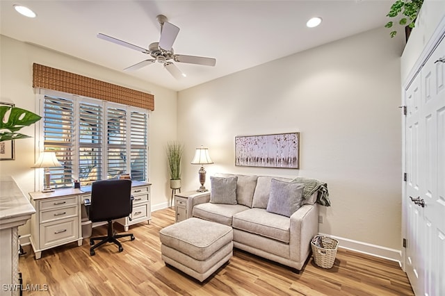 home office featuring light hardwood / wood-style floors and ceiling fan