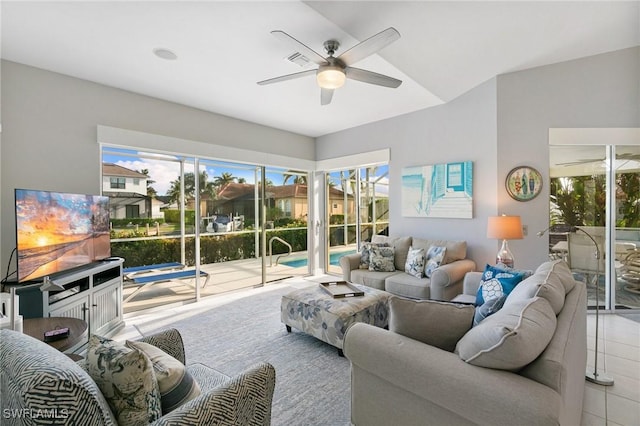 tiled living room featuring ceiling fan