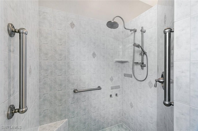 bathroom with a tile shower