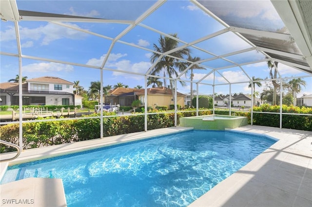 view of swimming pool featuring a lanai