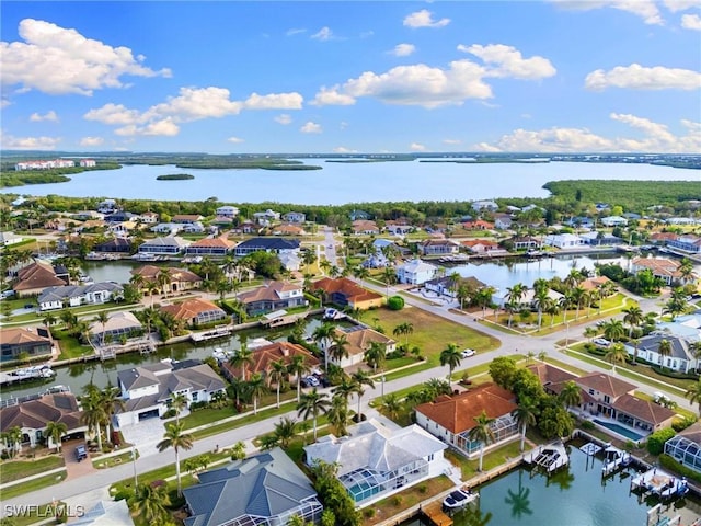 drone / aerial view with a water view