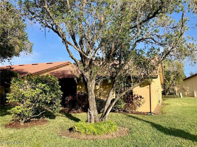 exterior space featuring a front lawn