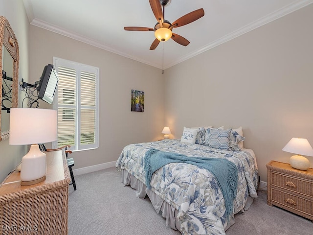 carpeted bedroom with ceiling fan and crown molding