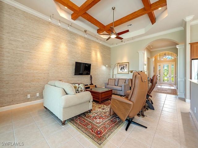 living room featuring beamed ceiling, light tile patterned floors, and coffered ceiling