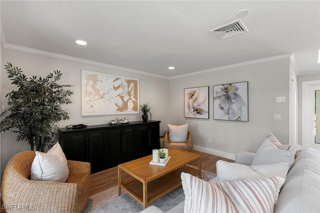 living room with crown molding and light wood-type flooring