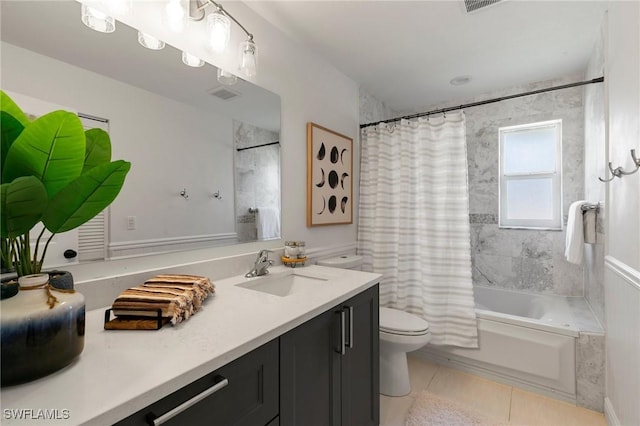 full bathroom featuring tile patterned flooring, shower / bath combo, toilet, and vanity