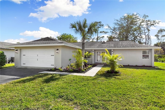 ranch-style house with a front yard and a garage