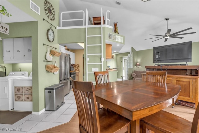 tiled dining space featuring washing machine and clothes dryer and ceiling fan