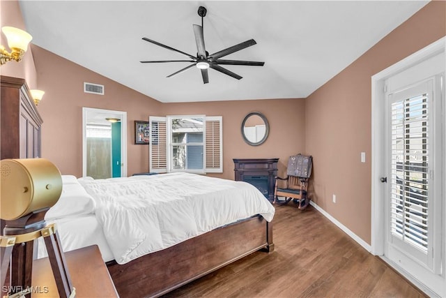 bedroom with wood-type flooring, access to outside, vaulted ceiling, and ceiling fan