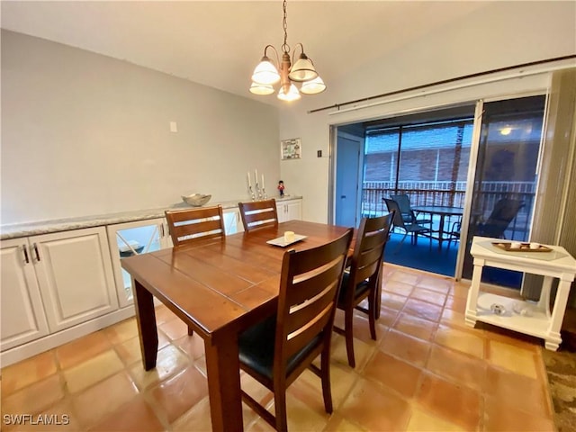 tiled dining space featuring a chandelier