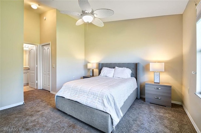 carpeted bedroom featuring ceiling fan, ensuite bathroom, and a closet