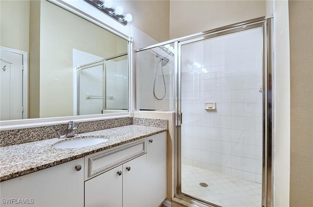 bathroom featuring vanity and walk in shower