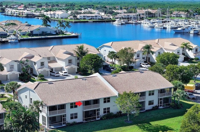 birds eye view of property featuring a water view