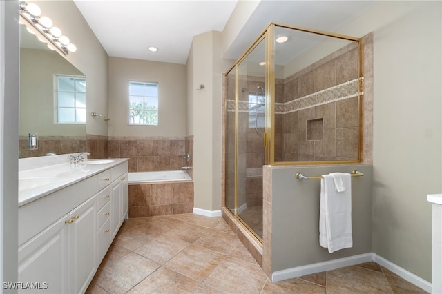 bathroom featuring tile patterned floors, vanity, and independent shower and bath