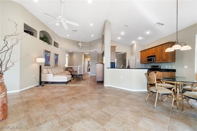 tiled living room with high vaulted ceiling and ceiling fan