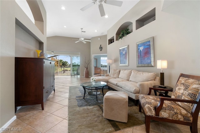 living room with ceiling fan, light tile patterned flooring, and high vaulted ceiling