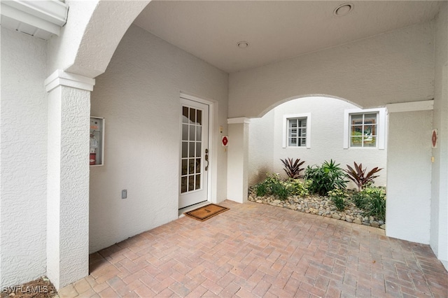 doorway to property featuring a patio area