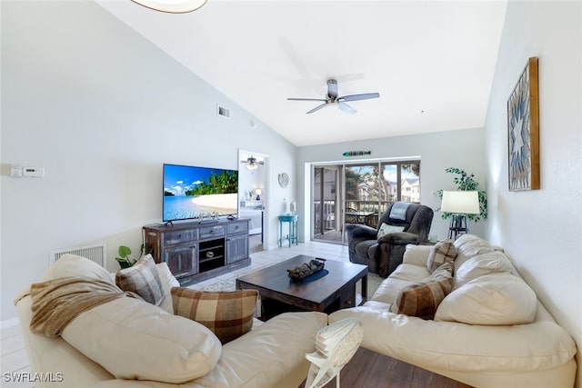 living room with ceiling fan and high vaulted ceiling